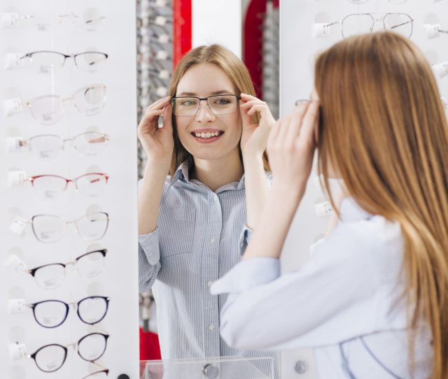 happy-woman-looking-new-glasses-optometrist1