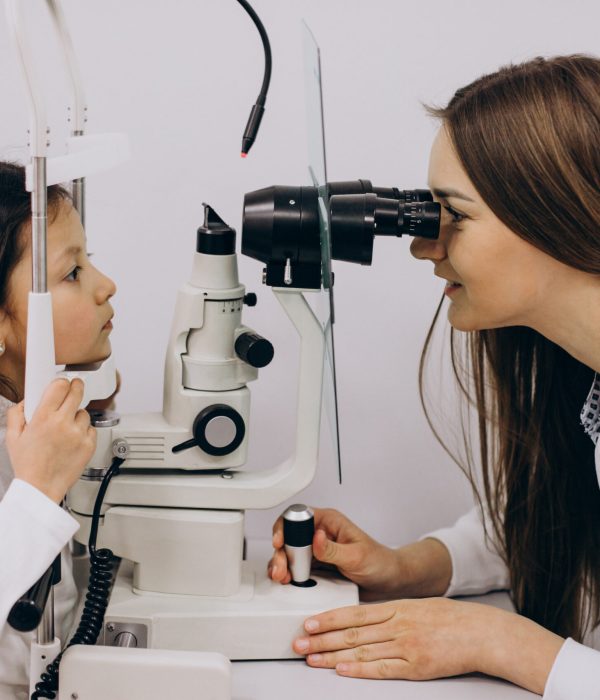 Little girl checking up her sight at ophthalmology center